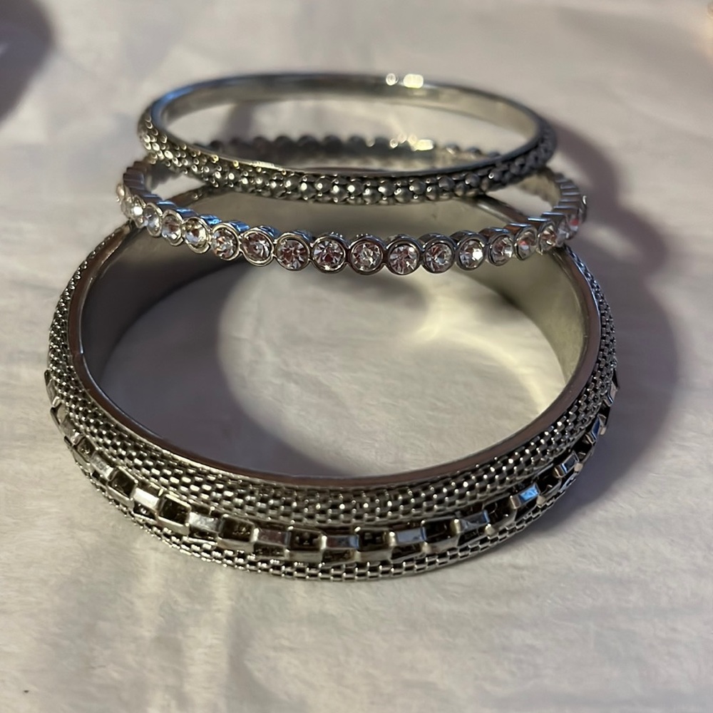 Three silver tone bangles